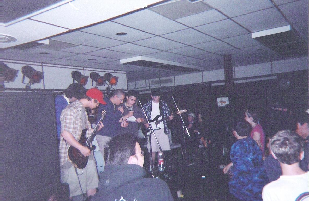 I'm behind Tom (the guy in the red hat), who I felt compelled to bring in as a second guitarist for that night. Good times.